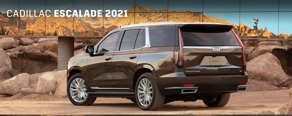 Cadillac Escalade 2021 SUV en color Dark Mocha Metallic con luces traseras LED y doble escape