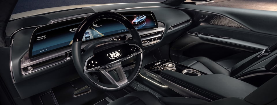 Interior de tu SUV eléctrica Cadillac LYRIQ con asientos de piel, pantalla led de 33 pulgadas y volante de 3 brazos con controles integrados